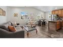 Bright and open living room with vaulted ceilings and hardwood floors at 9306 Ingalls St, Westminster, CO 80031