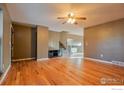Open living room featuring beautiful hardwood floors and a neutral color palette at 110 Lucerne Dr, Lafayette, CO 80026