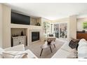 Cozy living area with a fireplace, comfortable seating, and ample natural light at 14300 Waterside Ln # V1, Broomfield, CO 80023