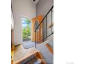 Inviting entryway featuring tile flooring, staircase and natural light at 1560 Findlay Way, Boulder, CO 80305