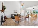 Spacious living room with fireplace, comfortable seating, and bright natural light at 1817 Juniper St, Longmont, CO 80501