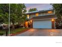 Traditional two-story home with ample parking, an inviting entrance, and great curb appeal at 2229 S Elkhart St, Aurora, CO 80014
