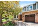 Charming home featuring a brick facade, well-maintained landscaping, and a two-car garage at 2345 Spotswood Pl, Boulder, CO 80304