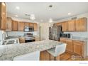 Spacious kitchen with granite countertops and stainless steel appliances at 24285 E Wagontrail Ave, Aurora, CO 80016