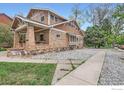 View of charming home with brick accents, showcasing its unique architectural details at 3116 47Th St, Boulder, CO 80301