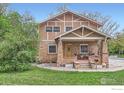 Charming two-story home with brick and stucco exterior and inviting front porch at 3116 47Th St, Boulder, CO 80301