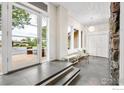 Spacious entryway featuring tile flooring, ample natural light, and views to the outside at 32399 Woodland Dr, Evergreen, CO 80439