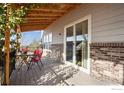Charming covered back deck with plenty of room for entertaining at 6483 S Irvington Way, Aurora, CO 80016