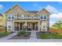 Charming two-story townhouse with well-maintained landscaping and inviting entrances at 17692 Olive St, Broomfield, CO 80023