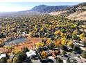 Breathtaking aerial shot of the property showcasing its location, lush surroundings, and mountain views at 3746 Wonderland Hill Ave, Boulder, CO 80304