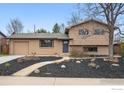 Charming home featuring a manicured front yard, brick accents, and an attached garage at 4035 Darley Ave, Boulder, CO 80305