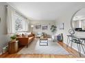 Spacious living room featuring hardwood floors, ample seating, and large windows at 4035 Darley Ave, Boulder, CO 80305