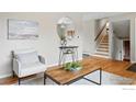 Inviting living room with hardwood floors, comfortable seating, and a decorative mirror at 4035 Darley Ave, Boulder, CO 80305