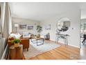 Bright living room featuring hardwood floors, ample seating, and stylish decor at 4035 Darley Ave, Boulder, CO 80305