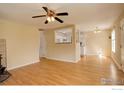 Spacious living room with hardwood floors open to the kitchen and dining area, perfect for entertaining at 503 E Oak St, Lafayette, CO 80026