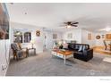 Inviting living room with plush carpet, ceiling fan and cozy furnishings for comfortable living at 5425 County Road 32 # 27, Mead, CO 80504