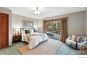 Serene main bedroom featuring a sliding glass door to a private deck and neutral decor at 1101 Peakview Cir, Boulder, CO 80302