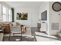 Comfortable living area with modern furnishings, decorative accents, and abundant natural light at 18722 E 99Th Ave, Commerce City, CO 80022