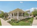 Well-maintained home featuring a covered front porch with white railings and beautifully landscaped front yard at 2917 13Th St, Boulder, CO 80304