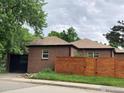 Brick home with a private fenced backyard and garage, perfect for families seeking security and convenience at 3201 Broadway St, Boulder, CO 80304