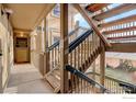 Staircase with wooden steps and railings leading to the apartments at 400 Emery St # 208, Longmont, CO 80501