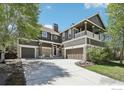 Charming two-story home with a balcony, stone accents, and a spacious three-car garage at 4109 Frederick Cir, Longmont, CO 80503