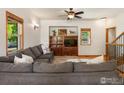 Comfortable living room featuring a large sectional sofa and a built-in entertainment center at 101 Se 2Nd St, Berthoud, CO 80513