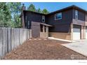 Spacious backyard with a privacy fence and fresh mulch at 1215 Centaur Cir # A, Lafayette, CO 80026