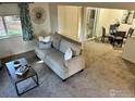Bright living room featuring stylish decor, neutral color palette, and plenty of space for relaxing or entertaining guests at 1215 Centaur Cir # A, Lafayette, CO 80026