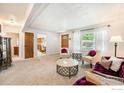 Cozy living room features plush carpeting, bright natural light, and comfortable seating at 1275 Walnut St, Brighton, CO 80601