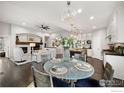 Bright and inviting dining area features modern lighting and flows seamlessly into living spaces at 15156 W Baker Pl, Lakewood, CO 80228