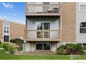 Apartment complex with brick and siding, showcasing balconies and mature landscaping at 1606 Cottonwood Dr # 16S, Louisville, CO 80027
