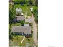 A bird's eye view of the home, detached garage, and greenhouse at 1815 9Th Ave, Longmont, CO 80501