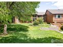 Expansive front lawn showcases mature trees and a well-kept exterior at 2725 Juniper Ave # 78, Boulder, CO 80304