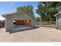 Spacious open garage with ample storage and a well-maintained fence, perfect for projects and parking at 531 S 9Th St, Berthoud, CO 80513