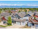 Aerial view of the neighborhood showcasing mountain views and a well-maintained exterior at 6681 6Th St, Frederick, CO 80530