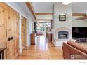 The living room features wooden floors and a fireplace, creating a cozy and inviting atmosphere at 9445 Lykins Pl, Boulder, CO 80301