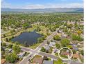 Aerial view of a home's location near a park and lake, showing neighborhood at 1229 Juniper St, Longmont, CO 80501
