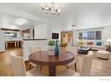 Eat-in kitchen and dining area with elegant dining table and comfortable seating arrangement at 1229 Juniper St, Longmont, CO 80501
