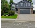 Charming two-story home with attached two car garage and manicured front yard at 12742 Clermont St, Thornton, CO 80241