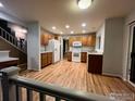Open concept kitchen with hardwood floors and lots of cabinet space at 12742 Clermont St, Thornton, CO 80241