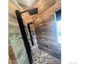Beautiful bathroom with stone floors and modern shower at 12742 Clermont St, Thornton, CO 80241