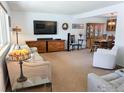Spacious living room featuring neutral colors, large tv, and ample seating at 1545 S Vivian St, Longmont, CO 80501