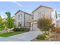 Inviting two-story home featuring a well-manicured front yard, stone accents, and a private driveway at 6229 Black Mesa Rd, Frederick, CO 80516