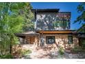 Inviting home exterior with stone details, fresh paint, and tidy landscaping at 788 Grant Pl, Boulder, CO 80302