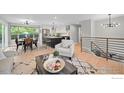 An open living space with a dining area and modern decor at 794 W Elati W Cir, Littleton, CO 80120