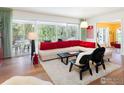 Stylish living room with large windows, modern furniture, and an open layout perfect for entertaining at 1035 Rosehill Dr, Boulder, CO 80302