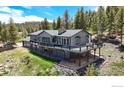 Two-story home with an expansive deck offering great outdoor space and views at 1100 Deer Trail Rd, Boulder, CO 80302