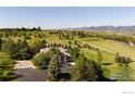 Expansive aerial view of the property and neighborhood showcasing the home's placement on a large lot at 160 Ponderosa Dr, Boulder, CO 80303