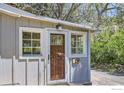 Home exterior showing the front door with sidelight windows and the house number at 29 Silver Spruce, Boulder, CO 80302